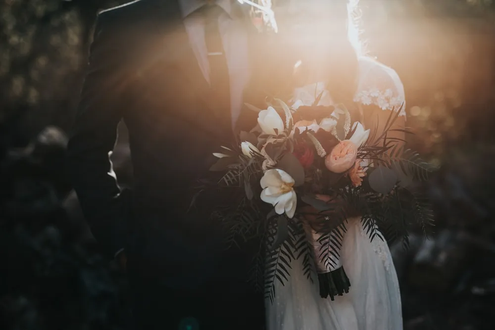 Couple reading wedding vows at their ceremony