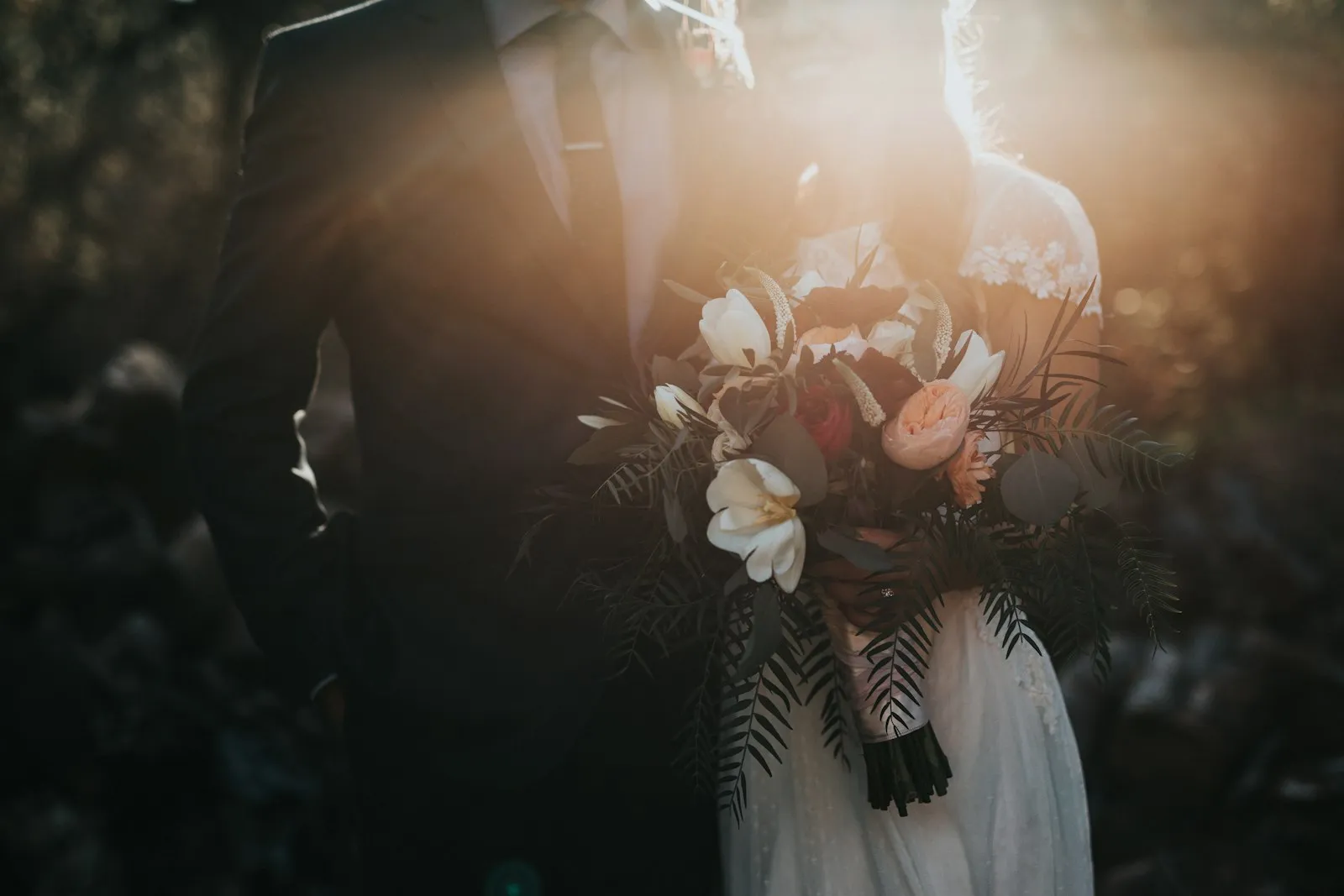 Couple holding hands at a wedding ceremony